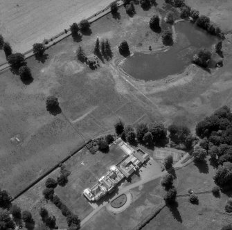 Oblique aerial view showing Lawers country house, chapel and garden.