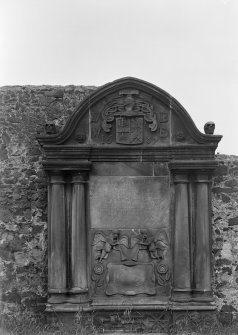 View of heraldic memorial in churchyard dated 1689