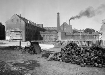 Perth, Pullar's Dyeworks.
General view of dyeworks, East end of Mill Street and Castle Gable, with street cobbling in progress in foreground.