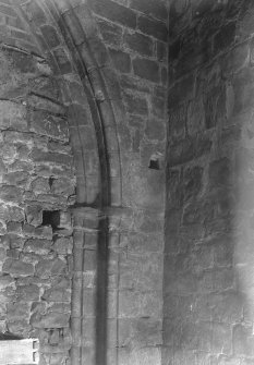 South jamb and springer of arch between tower and nave.