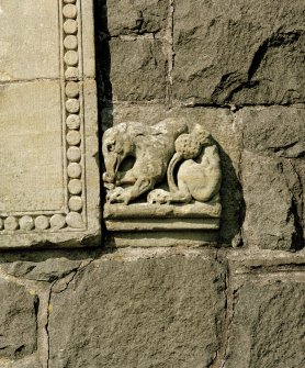 Detail of zoomorphic figure on right side of doorway