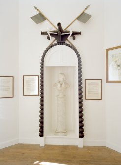 Interior. 1st floor, view of monument with Nelson bust