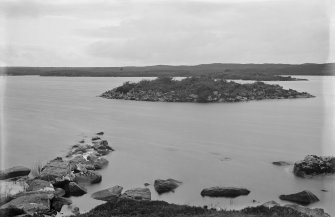 General view of island dun showing remnants of causeway.