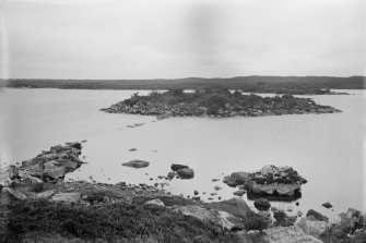 General view towards dun showing remnants of causeway.