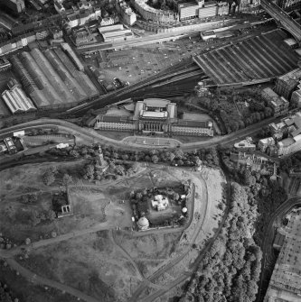 Digital copy of oblique aerial view of Edinburgh, taken from the NE, centred on Calton Hill showing the city observatory, the National and Nelson Monument. St Andrew's House is also visible.