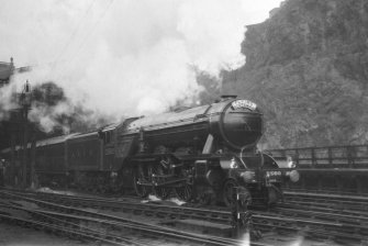 View of A3 4-6-2 locomotive 2580 'Shotover' pulling the 'Flying Scotsman' service out of Waverley Station.
PHOTOGRAPH ALBUM NO 52: THE EMPIRE EXHIBITION ALBUM. Page 17.