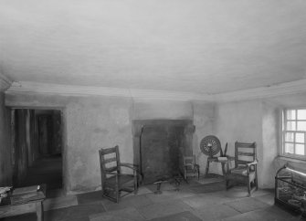 Glasgow, Auchinlea Road, Provan Hall, interior.
View of fireplace with chairs and spinning wheel.