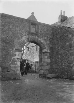 Glasgow, Auchinlea Road, Provan Hall.
View of entrance with two gentlemen emerging from courtyard.