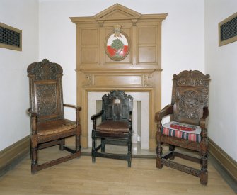 Interior, ground floor, reception room, view of fireplace and oak chairs