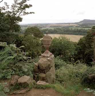 View of ornamental urn and view beyond from E.