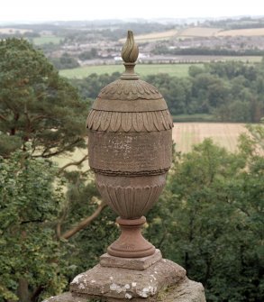 Detail of ornamental urn showing inscription.