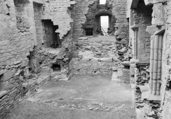 Excavation photograph: Film 8, Frame 34 - View from the east into the first-floor hall of the tower house, with the ground-level kitchen in the foreground. Note the oven on the south side of the kitchen fireplace. From the 1994 season excavation at Melgund Castle.
Illustration 6 in publication.
