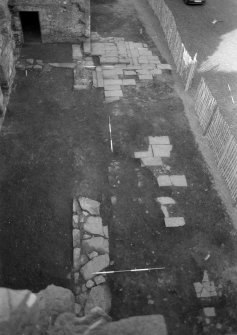 Excavation photographs: Film 2, Frame 21 - The north side of the castle, showing the excavated remains of the north wall of the passage, the vestibule and the paved floor of the barmkin. Viewed from the east. From the 1991 season excavation at Melgund Castle.
Illustration 7 in publication.