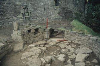 Excavation photographs: View northwards from the interior of structure F308, showing the doorway and, to its east, the recess with its blocking removed.
Illustration 11 in publication.