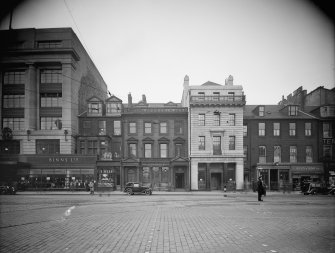 View from south of 137 - 144 Princes Street showing pedestrians, cars and traffic warden.