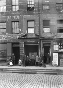 General view of entrance to Milne's Court, Edinburgh, on Lawnmarket elevation, with D Blake & Co and J Gilchrist Groceries & Provisions.