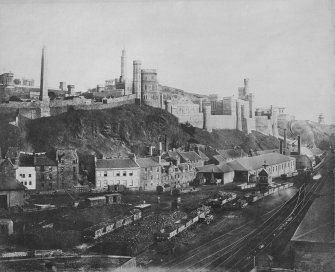 View of Calton Hill and Calton Jail, Edinburgh looking over railway tracks and coal wagons at the eastern entrance to Waverley Station.