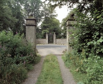 General view of main gates through lodge gates to East.