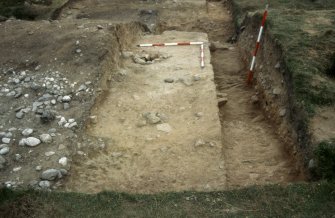 Excavation photographs: Film 68 from the 1996 season at Brown Caterthun.
Trench 14: Rampart F, cobble layer, buried turf and posthole from the north-west.