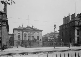 View of front facade and forecourt from North West.