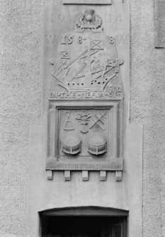 Newhaven, Carved Stone Panel.
View of panel, with carved shop emblem, and heraldic symbols, insc: '1588  In the neam of God    Per Vertuti Sydera Terra Mare'.  Removed from original location, and house demolished - now set in concrete at no. 84 Main Street, insc: '1914'.