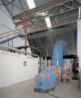 Interior. View of waterwheel/turbine house. Note the 'pentrough' above which carried the lade and fed the waterwheels (now removed).