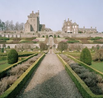Drummond Castle. General view of keep, house and formal gardens with sundial from South.
