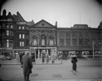 View of the Royal British Hotel, The Palace Cinema  and Woolworths (since demolished) on Princes Street, Edinburgh showing pedestrians and cars.