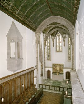 Interior. Chapel. View from gallery towards chancel including oriel window