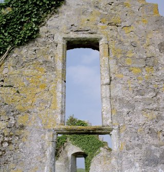 Window above main doorway on E gable, view from E