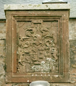 Detail of armorial panel above doorway to courtyard on north front