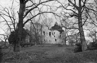 Old Tulliallan Castle.
View of castle through trees. 
Scanned from glass plate negative. Original envelope annotated by Erskine Beveridge 'Tulliallan Cas[tle]'.