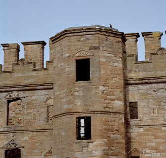 Courtyard, north facade, central tower, view of top section