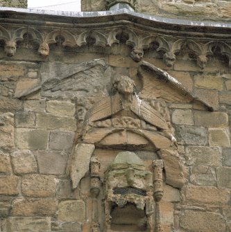 Courtyard, east facade, detail of carving over entrance