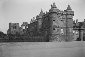 General view of North wing of Holyrood Palace showing James IV's Tower in foreground and Holyrood Abbey behind