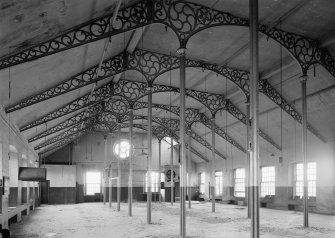 Interior view of Ward Mills, Dundee showing ornate cast iron trusses prior to demolition.