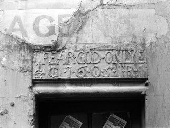 Edinburgh, 8-10 Gloucester Street, David Robert's House.
Detail of the inscription on the lintel, and a painted sign above: 'Agent'.
Insc: 'Fear God Only. 1605, IG, IR'.
