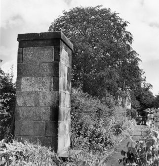 Detail showing astronomical pillar in garden.