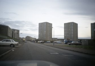 Aberdeen,  Balnagask Circle (Balnagask South Section 14): View from road of three 14-storey blocks amongst low-rise development.