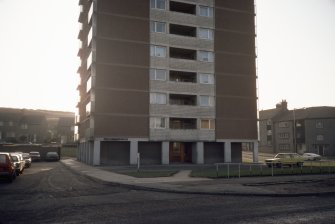 Aberdeen, Tolohill Square (Kincorth Section 49): View of lower levels of Kincorth Land tower block showing central shared balconies. Housing estate visible in the background.