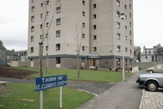 Aberdeen, Jasmine Place, St Clement's Court: View of lower levels of an 11-storey block in its immediate landscape. Housing visible in the background.