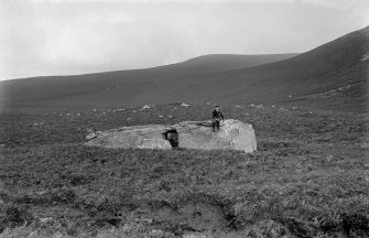 Hoy, Dwarfie Stane.
General view of Dwarfie Stane with figure seated on top.