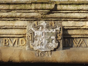South entrance, detail of coat of arms on lintel.