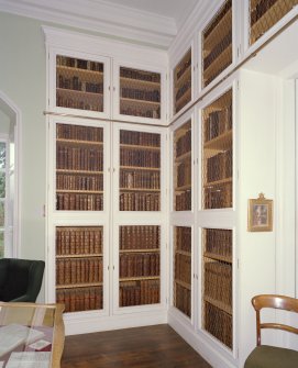Interior. Main floor, library, view of book cases