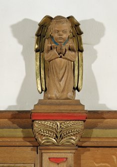Interior.
Detail of carved angel on reredos.