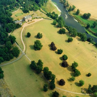 Mertoun House, oblique aerial view, taken from the WNW, centred on the country house and the formal gardens.