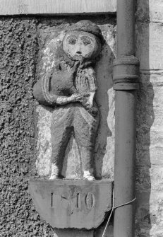 Detail of date stone with carved piper above, Loanfoot, Skirling.
