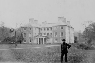 View from South of Dryden House, Midlothian, with man standing in foreground.