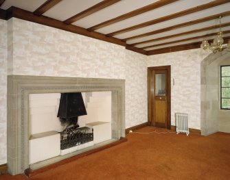 Interior. First floor view of long hall fireplace