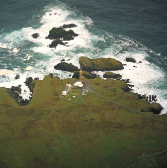 Oblique aerial view centred on the Butt of Lewis lighthouse with the remains of the enclosure adjacent, taken from the S.